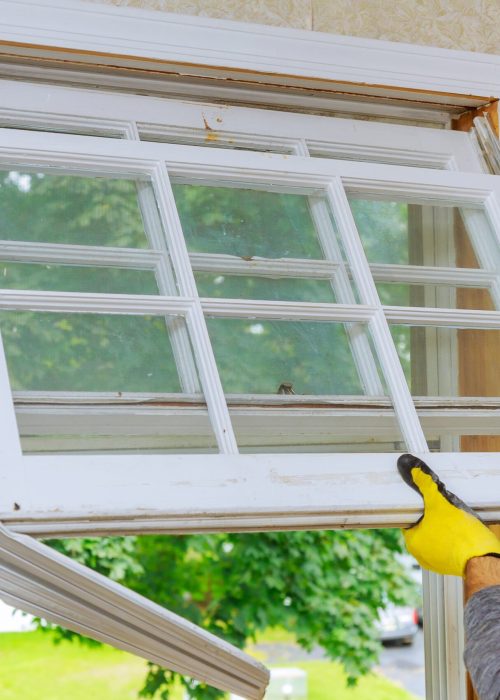 Home repairs, replacement windows. Master removes old window